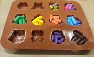 Silicone mold filled with broken crayons