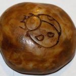 Stone with etched ladybug